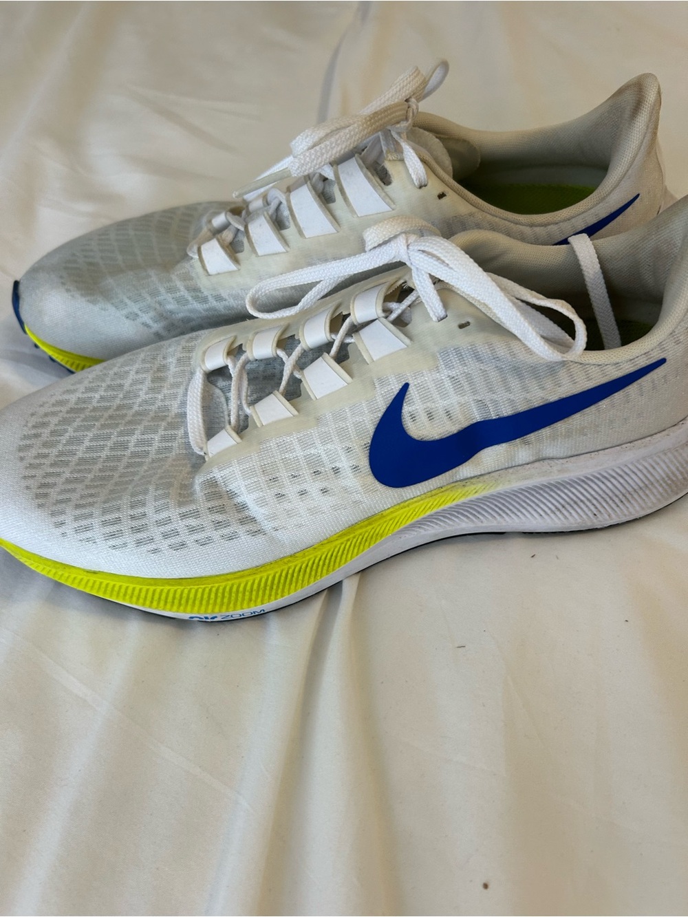 Nike Men’s White Sneakers with Blue Swoosh and Yellow Accent